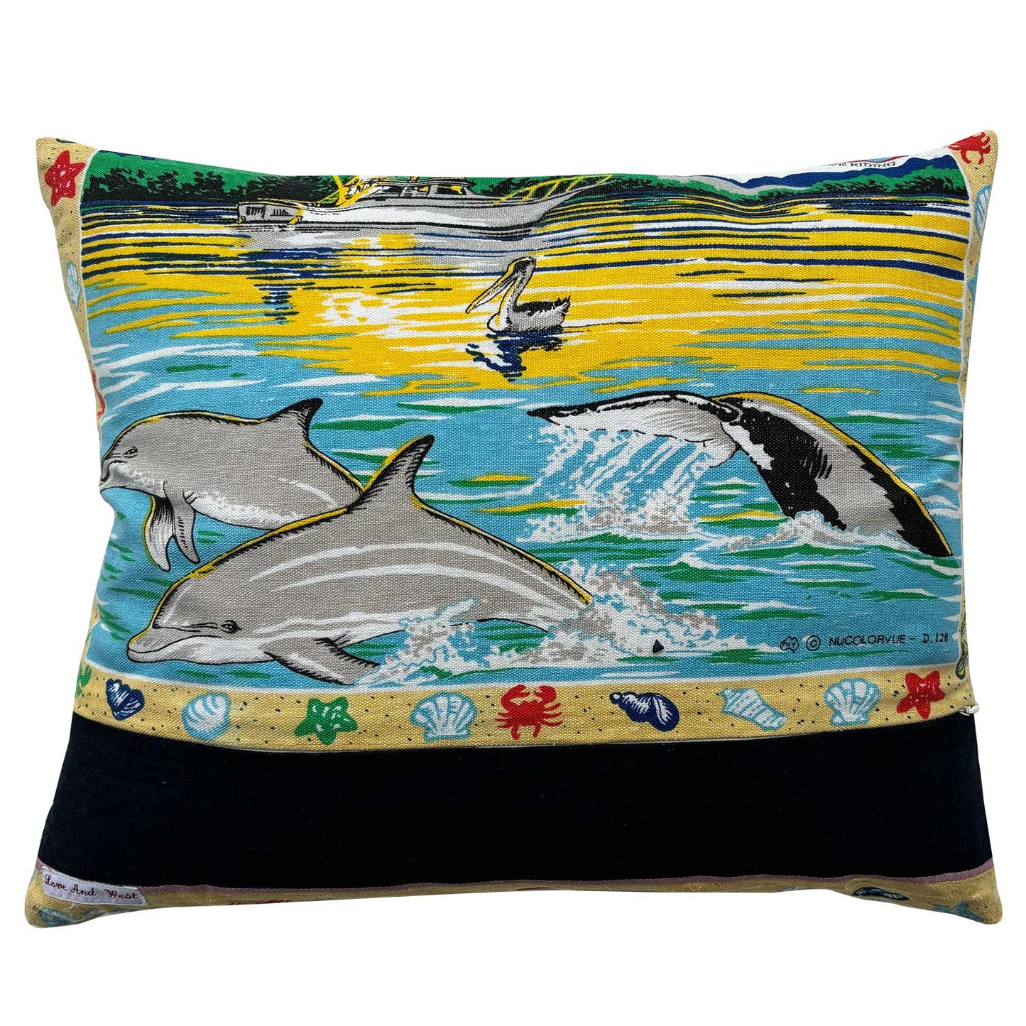 Decorative pillow with Merimbula, New South Wales design featuring a parrot and beach scenes on white background