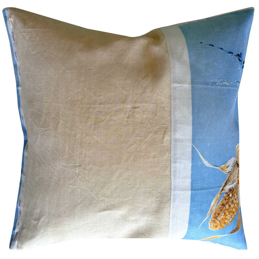 Pale blue and ears of corn vintage linen cushion cover on white background, reverse view with blush pink linen