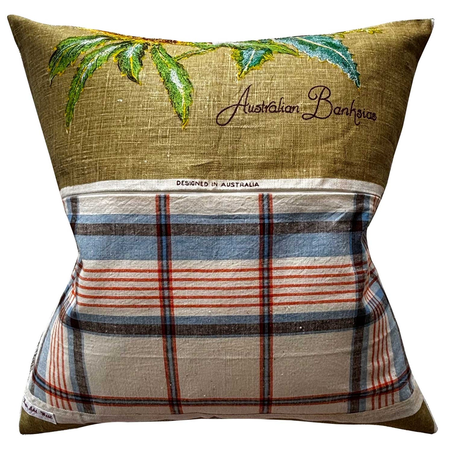 Decorative pillow repurposed from vintage linen teatowel with repurposed tablecloth reverse, on white background