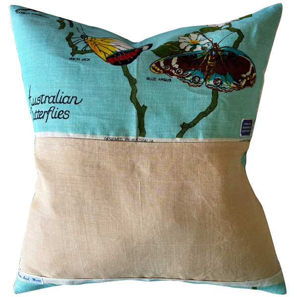 Blue butterflies of Australian vintage linen cushion cover , reverse, on white background
