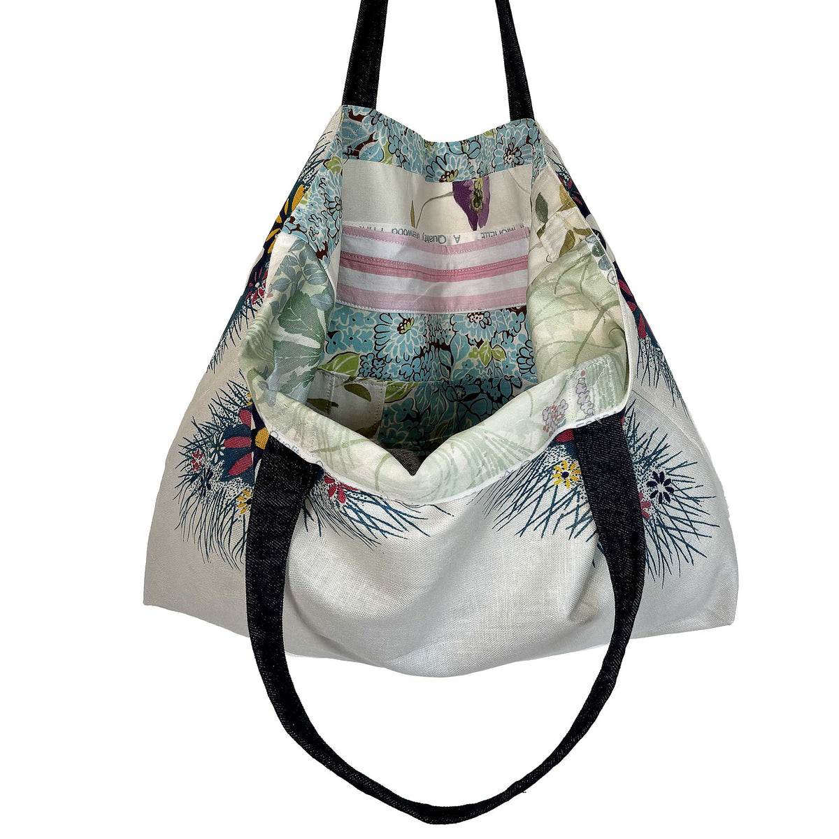 Blue floral vintage linen teatowel tote interior lining and pocket on white background