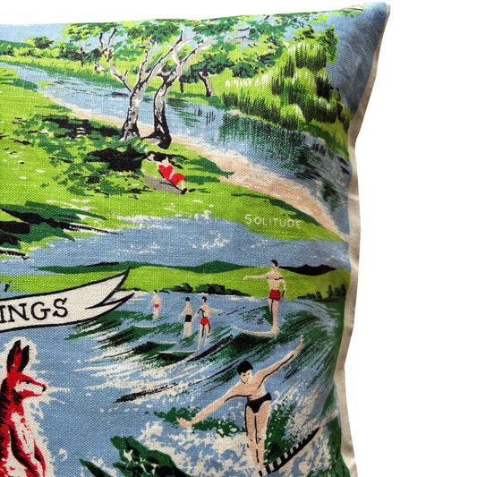 Detail from Decorative repurposed vintage linen teatowel cushion cover, with a kangaroo design and scenic text, featuring a colourful illustrations of gold coast scenes, on white background.