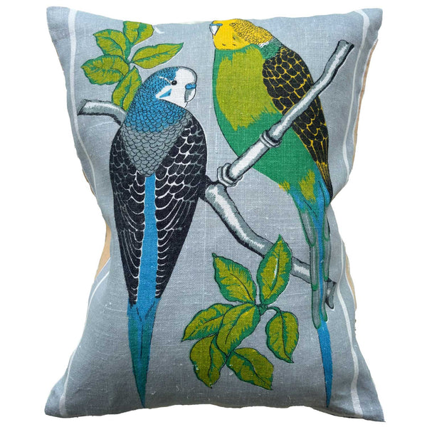 Decorative pillow with budgies design on a pastel grey background. photographed on white background for Love And West