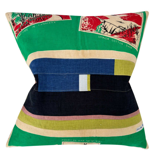 Decorative pillow with images of Canberra, Australia on a green background, on white