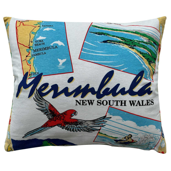 Decorative pillow with Merimbula, New South Wales design featuring a parrot and beach scenes on white background