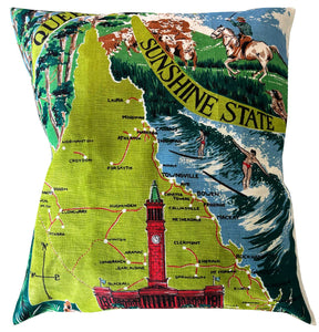 Decorative pillow with a map design of Queensland, Australia, featuring landmarks and text on white background