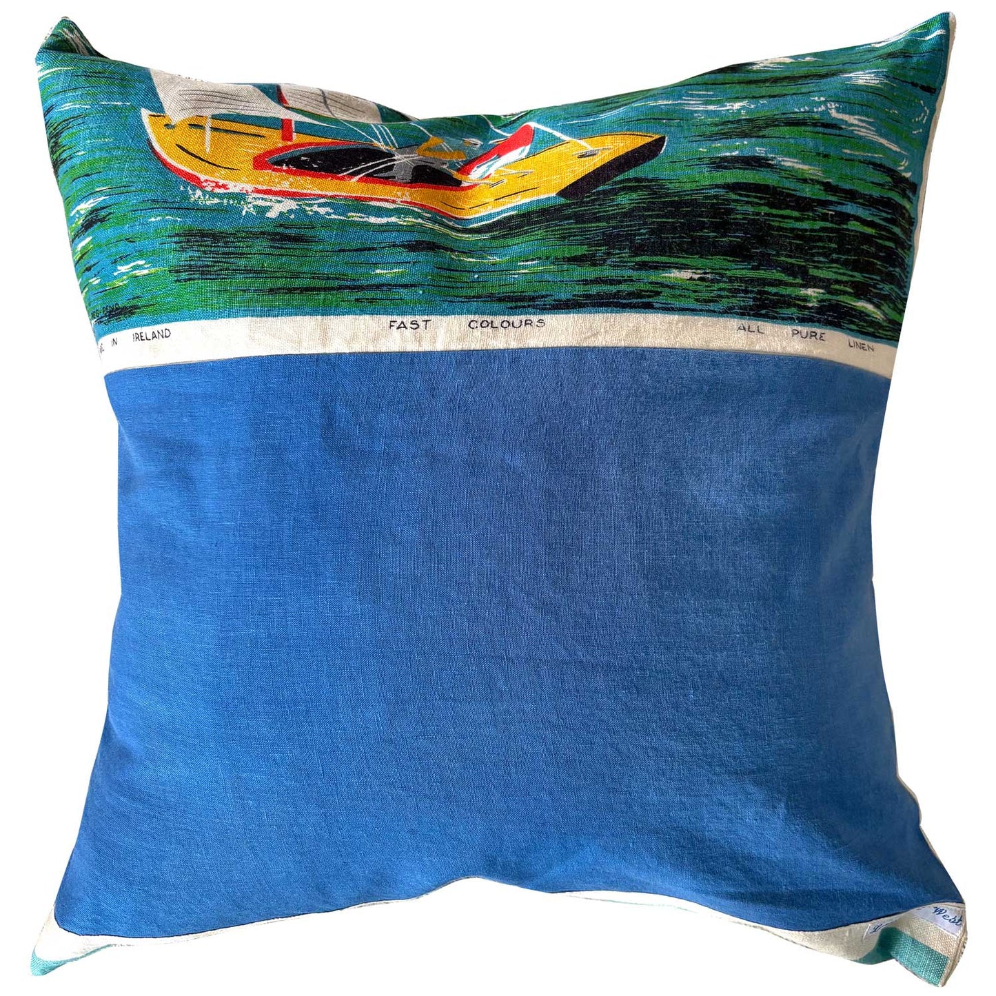 REverse view Decorative pillow with a Sydney Harbour scene featuring sailboats and a bridge.