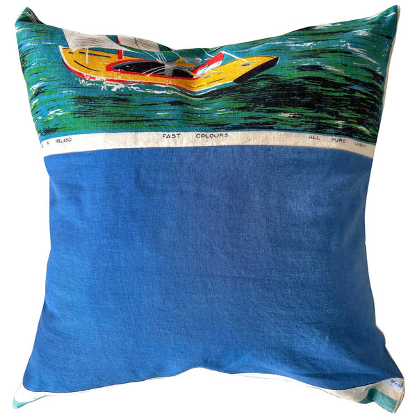 REverse view Decorative pillow with a Sydney Harbour scene featuring sailboats and a bridge.