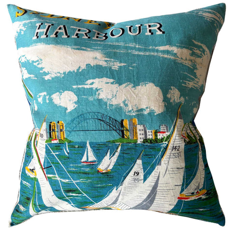 Decorative pillow with a Sydney Harbour scene featuring sailboats and a bridge.