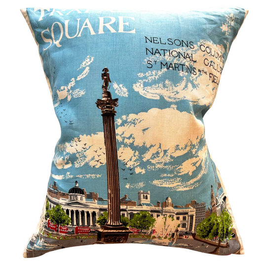 Decorative tea towel pillow with a design of Trafalgar Square, Nelson's Column and surrounding buildings with blue sky, on white background