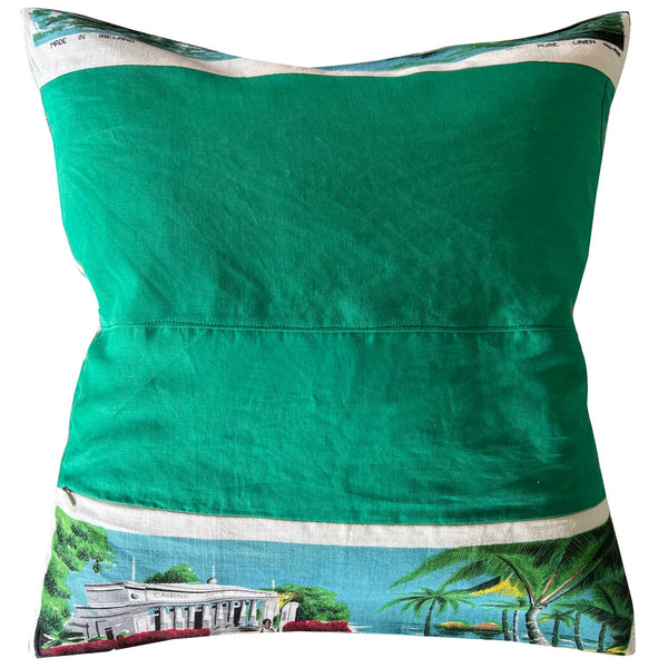 Decorative pillow with a map design of Whitsunday Islands and beach scenes on a white background